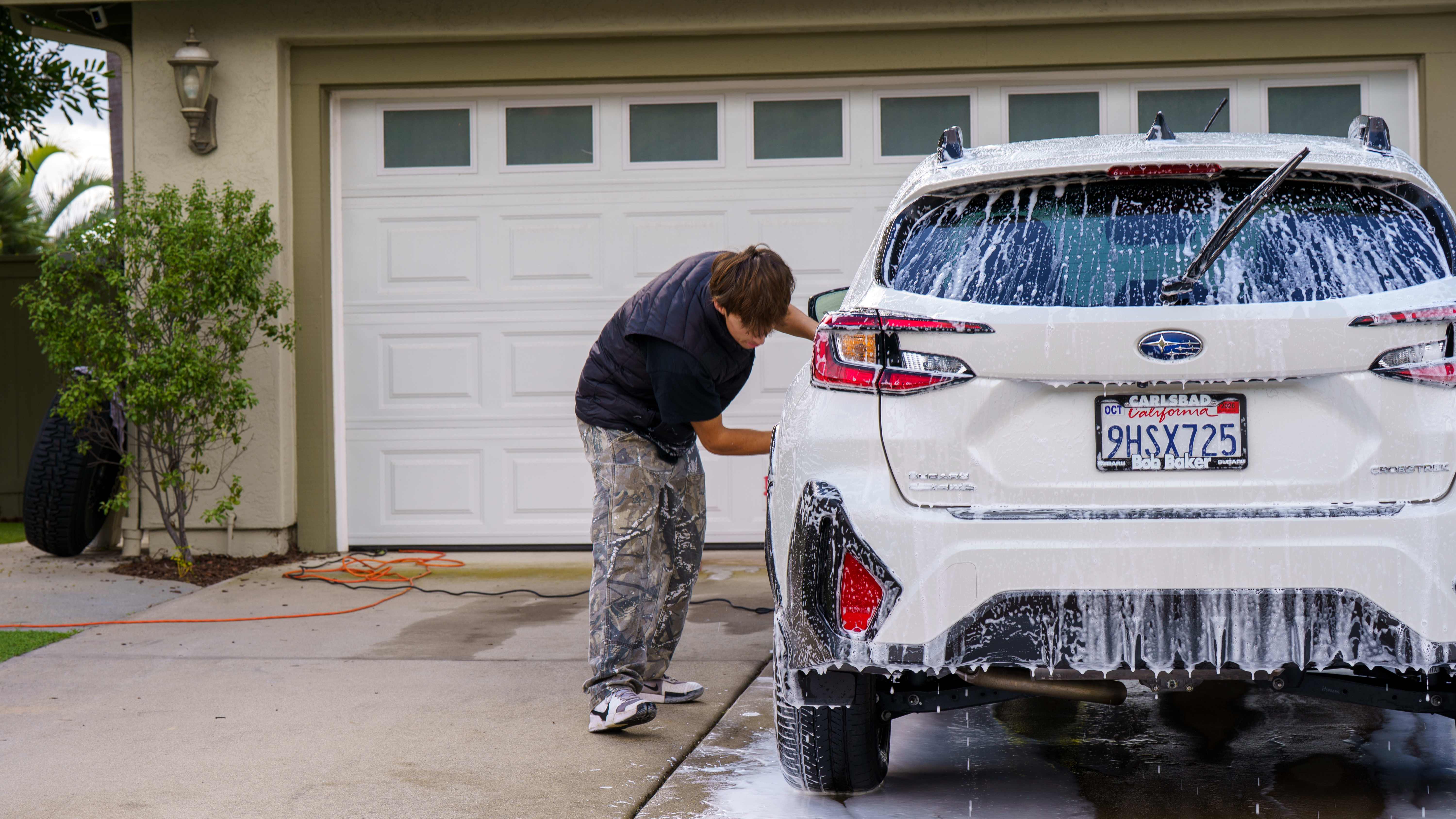 Foam washing a white Subaru Crosstrek